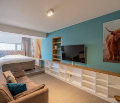 Appartement pour 4 personnes à Barvaux : hébergement moderne avec sauna, jardin et lit bébé