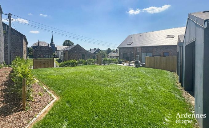 Charmante maison de vacances  Bastogne : sjour confortable pour 8 personnes avec jardin priv et station de recharge