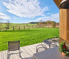 Maison de vacances à Saint-Hubert : hébergement confortable pour 6 personnes avec sauna, salle de jeux et jardin privé en Ardenne
